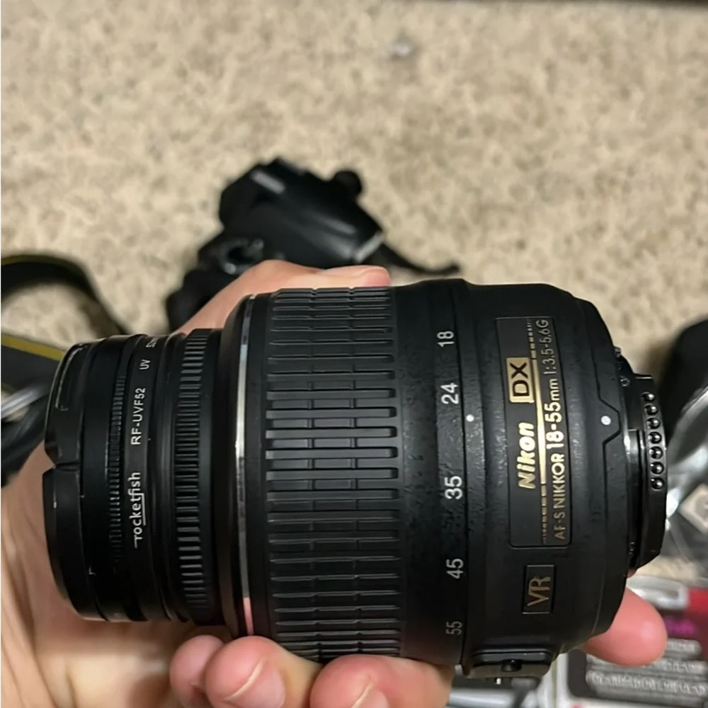 Nikon D5000 DSLR Camera with 18-22 mm lens & 1 battery, bag, and more
